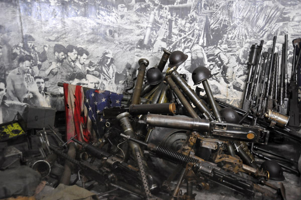 Captured American military gear and a tattered US flag, Victorious Fatherland Liberation War Museum