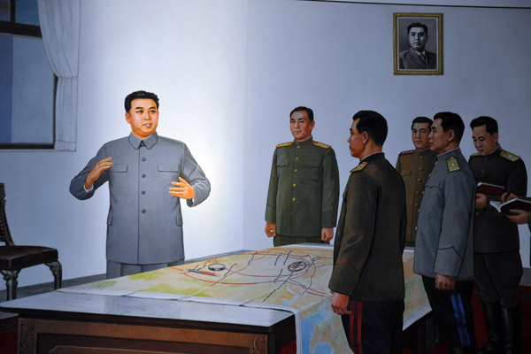 Kim Il Sung planning a battle with his generals