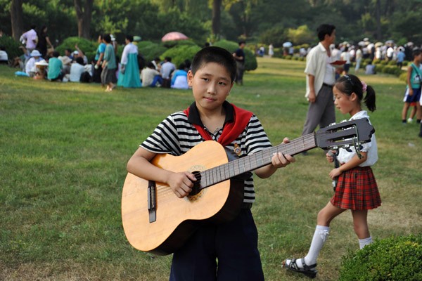North Korean boy with guitar, Moranbong Park