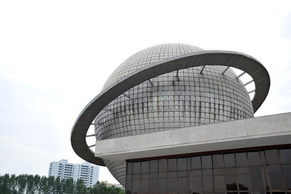 Three Revolutions Exhibition - the Saturn-like sphere houses a large planetarium