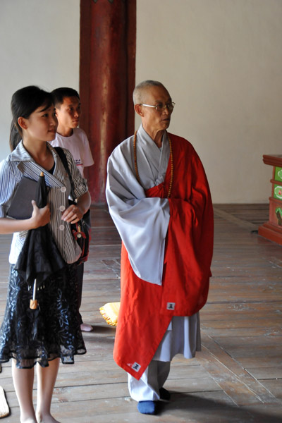 Korean Buddhist monk guiding us through Taeung Hall
