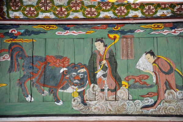 Bodhisattva petting the mythological haetae, a Korean fire-eating dog which resembles a lion
