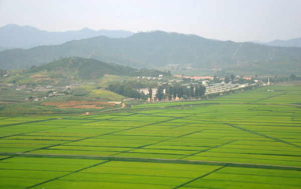 The rice paddies and hill Wangjwa-san near Pyongyang Airport, North Korea