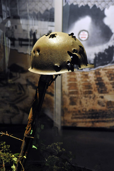 Shot-up Korean War-era helmet