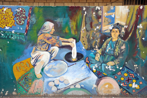 Mural of Kurdish women preparing food on the wall of Salahaddin University, Erbil