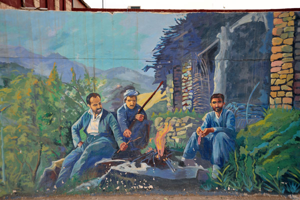 Mural of Kurdish men by a fire in front of a rural house, Salahaddin University, Erbil