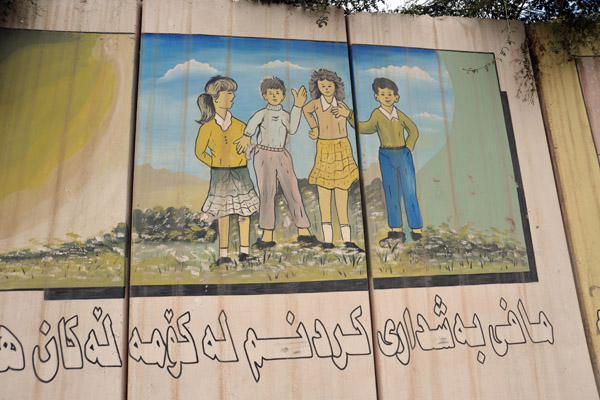 Kurdish Mural - girls in skirts together with boys