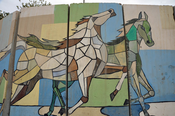 Painting of horses on the blast wall in front of the Hawler Governate, Erbil