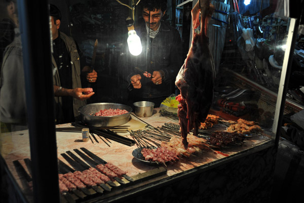 Preparing kebabs at a street stall, Erbil Bazar
