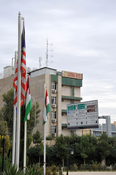 American flag, among others, in front of the Erbil International Hotel