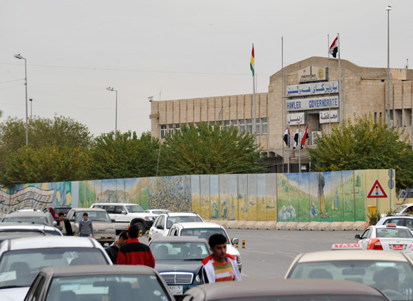 Hawler Governate behind a blast wall painted with murals
