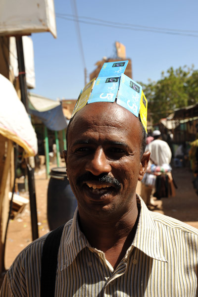 Man wearing a cap of phone cards
