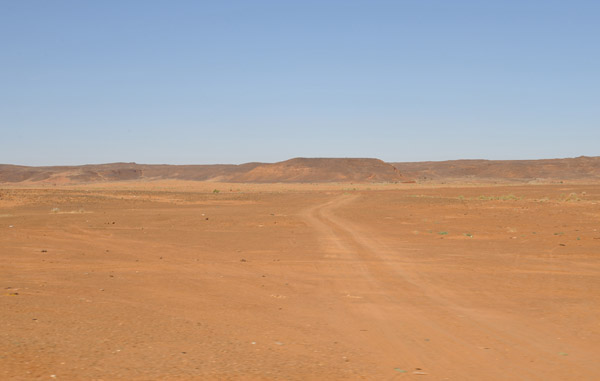 Dusty track across the open desert northwest of Khartoum