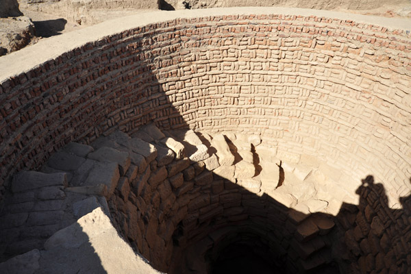 Interesting brick-lined well with a stone circular staircase