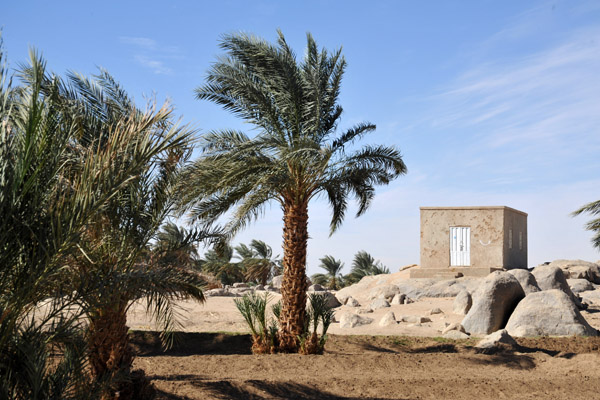 Small building among the stones and palms, Tombos