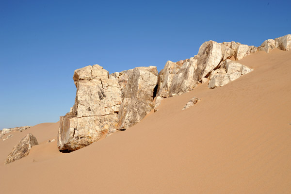Sand captured by a ridge of marble, Bayuda Desert