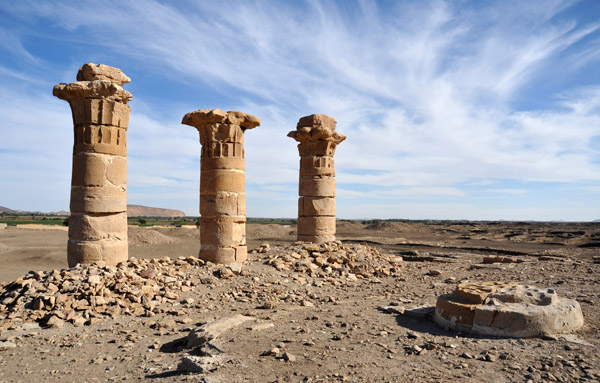 Temple of Sesibi, three columns and a pile of rubble