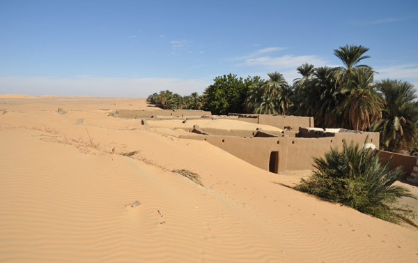 Nubian houses half-buried by sand dunes
