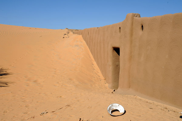 Courtyard of a Nubian home filled with sand