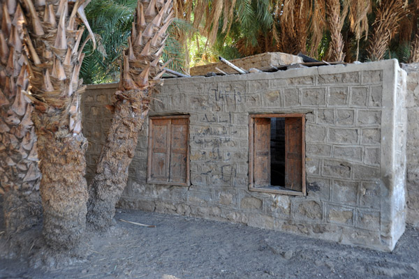 A sturdy stone house among the palms of Sai Island