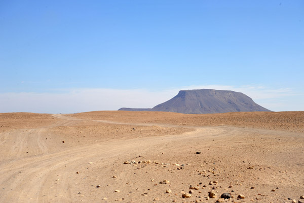 Dirt track in the middle of Sai Island with Jebel Abri