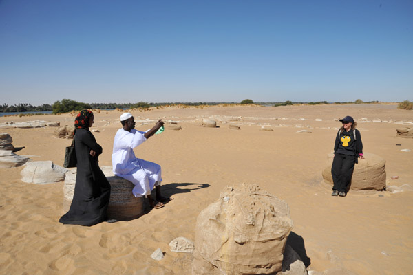 A Sudanese couple at Kawa taking a photo of Karen