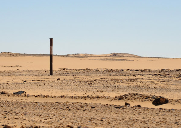 Before the new road, the desert track was marked by these posts placed at regular intervals