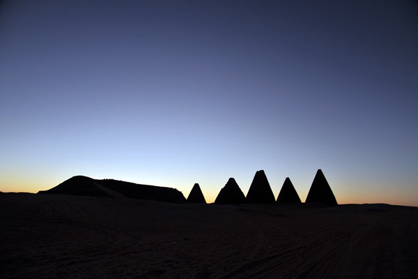 The pyramids of the northern group with the outline of Jebel Barkal, pre-dawn