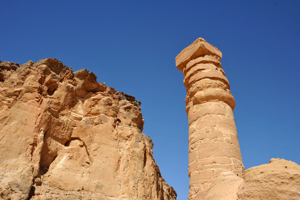 A column of the Great Temple of Amun with the southern cliffs of Jebel Barkal
