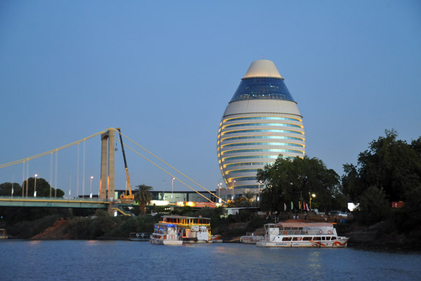 Burj Al-Fateh Hotel at dusk from the river, Khartoum