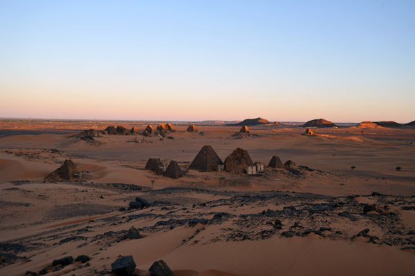 The first rays of light touch the northern pyramids, Mero