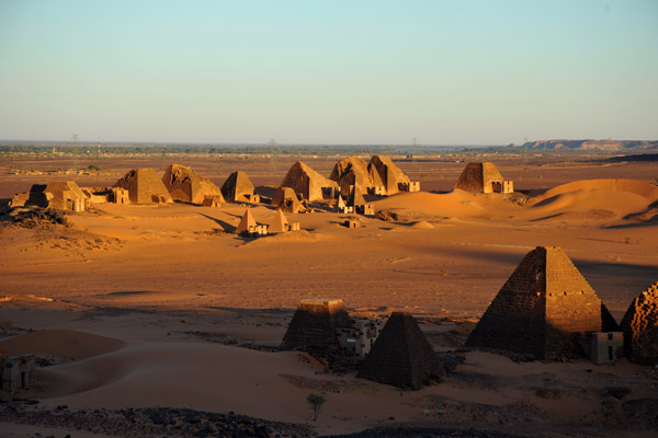 The sun climbs high enough to light up the tallest pyramid in the southern group
