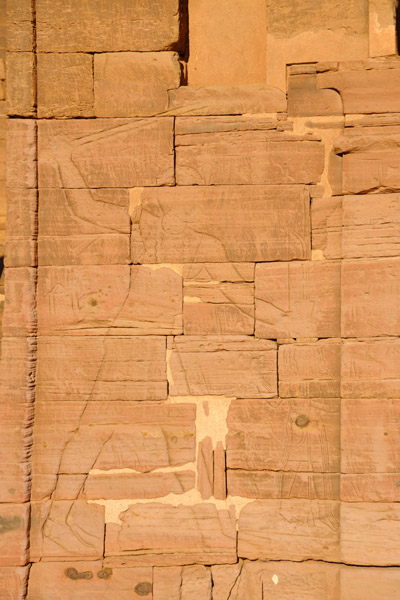 Carving of King Tarekeniwal smiting his enemies