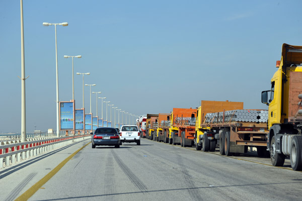 Trucks backed up for miles along the King Fahd Causeway approaching the border checkpoint