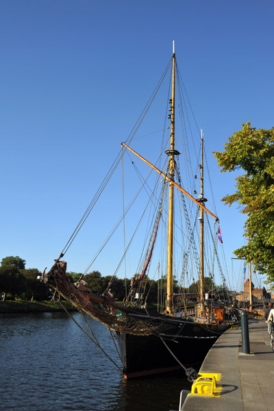 Sailing ship tied up on the Trave River