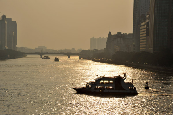 A tourist boat sets off on a Pearl River sunset cruise 