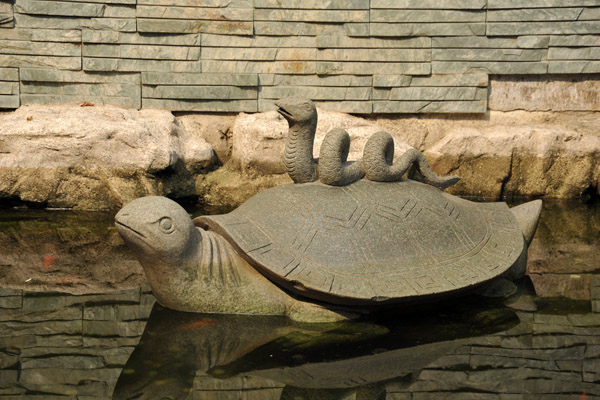 Statue of a snake sitting on a turtle, Guangxiao Temple
