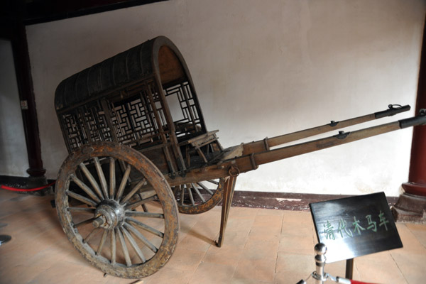 Two-wheeled cart on display at the Five Immortals Temple