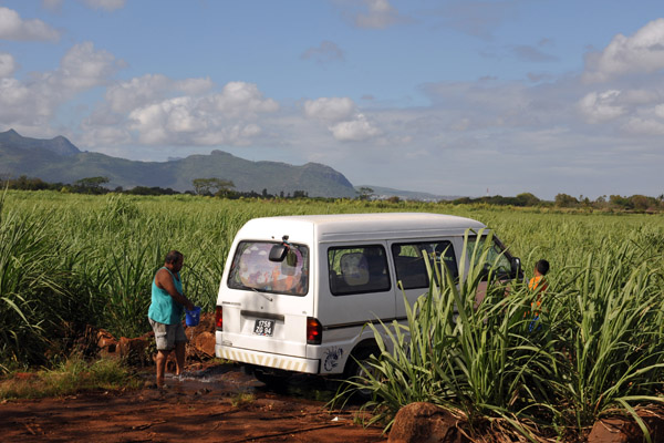 Washing the bus in a small stream through the sugar cane fields near Balaclava