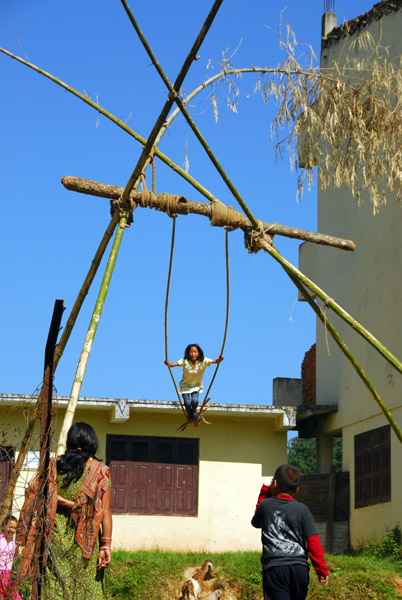 Playing on a bamboo swing, Dhulikhel