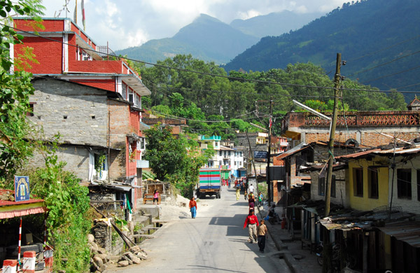 Observing a Nepali town from the top of a public bus