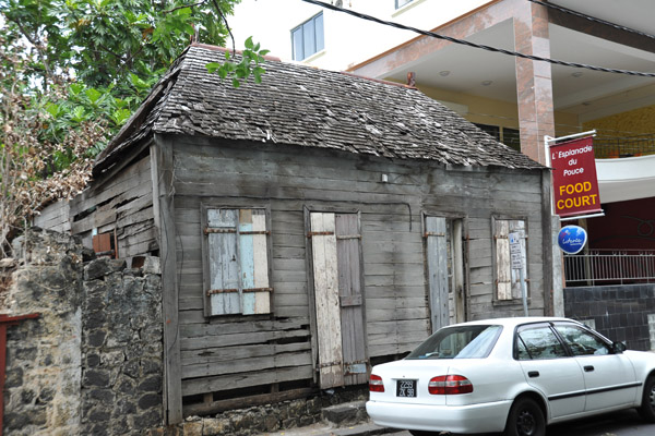 An old abandoned and weather-beaten wooden cabin left over from the early days of Port Louis