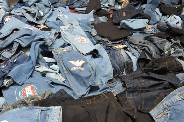 Piles of jeans of a street vendor, Port Louis