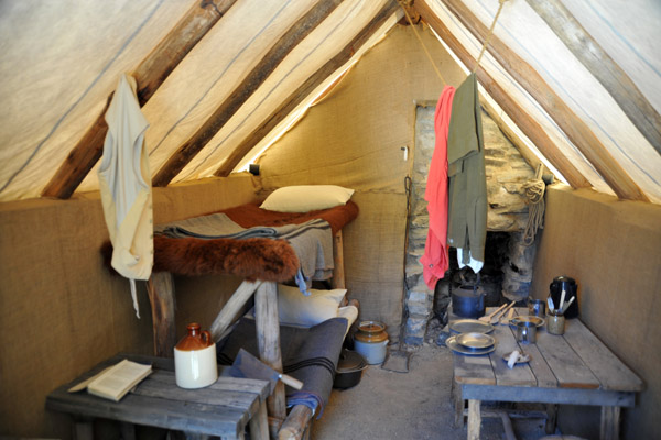 Miners tent with bunk beds and stone fireplace, Sovereign Hill