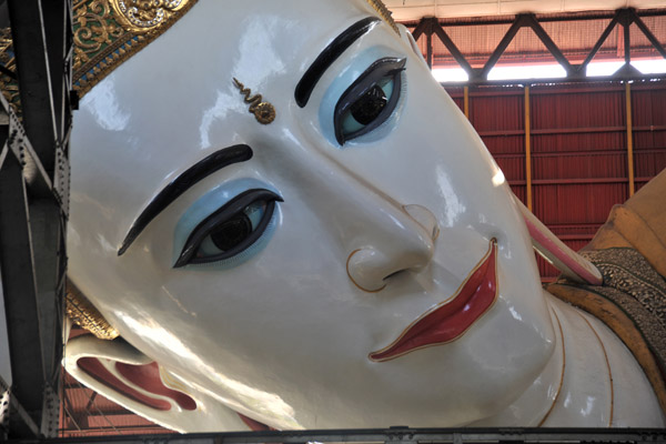 Serene face of the Reclining Buddha of Chaukhtatgyi Paya, Yangon