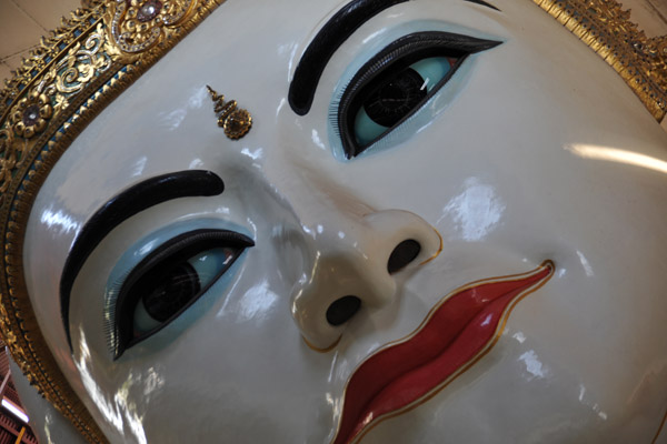 Painted face of the Reclining Buddha of Chaukhtatgyi Paya