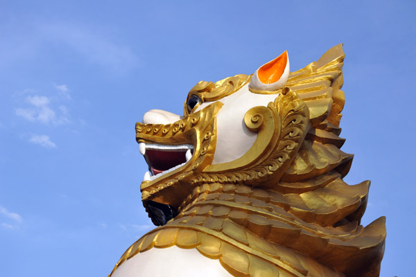 Detail one of the giant guardian lions at Ngahtatgyi Paya