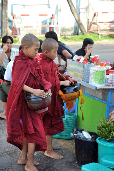 Novice monks with begging bowls, Yangon