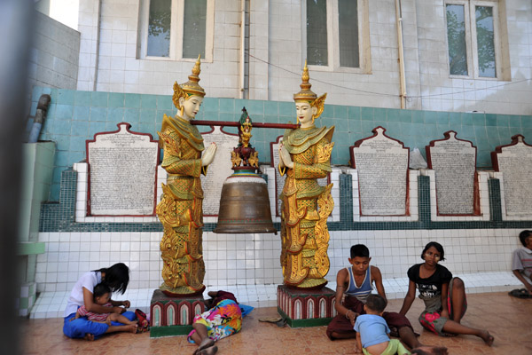 People escaping the heat by relaxing around Sule Paya