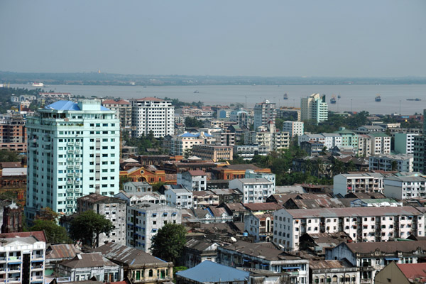 Central Yangon with a high rise block on Anawratha Road